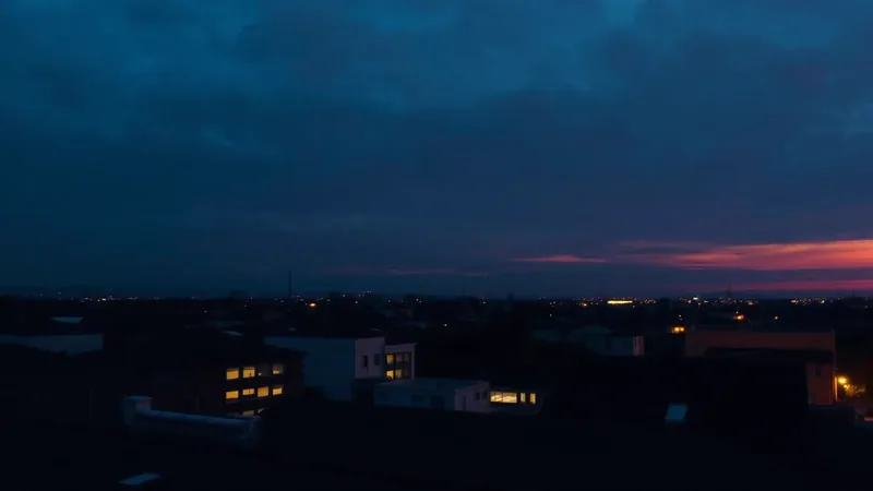 Dark rooftop skyline at dusk with subtle glowing data lines representing AI search visibility for roofing companies